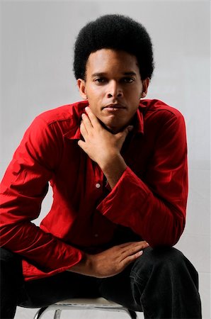 simsearch:400-04732323,k - Portrait of young african american male model sitting Foto de stock - Super Valor sin royalties y Suscripción, Código: 400-04579441