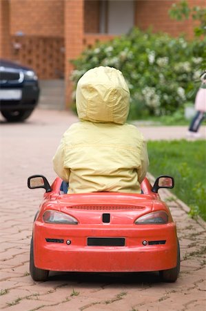 simsearch:400-04638236,k - The Child Driving Red Car Photographie de stock - Aubaine LD & Abonnement, Code: 400-04570914