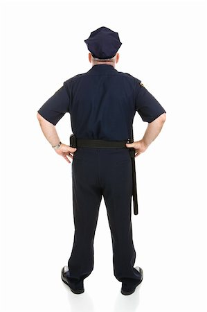 Rear view of a mature police officer in uniform.  Full body isolated on white. Stock Photo - Budget Royalty-Free & Subscription, Code: 400-04571634