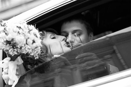 simsearch:400-04978489,k - Newly-married couple in car with champagne Stock Photo - Budget Royalty-Free & Subscription, Code: 400-04584915