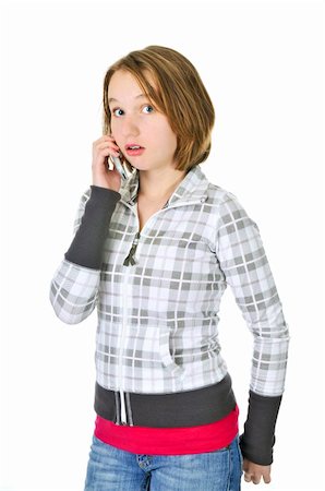 simsearch:400-05012508,k - Teenage girl talking on a cell phone acting surprised isolated on white background Foto de stock - Super Valor sin royalties y Suscripción, Código: 400-04586228
