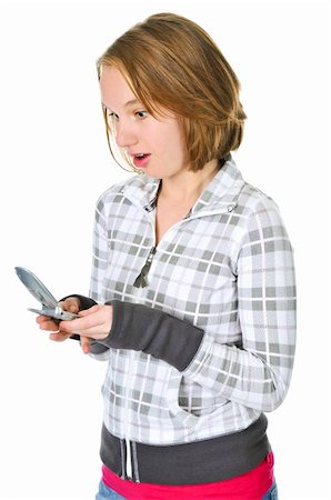 simsearch:400-05012508,k - Teenage girl text messaging on a cell phone isolated on white background Foto de stock - Super Valor sin royalties y Suscripción, Código: 400-04586229