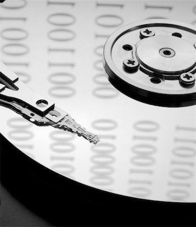 simsearch:400-05252692,k - Internals of a harddisk with binary code reflections Stock Photo - Budget Royalty-Free & Subscription, Code: 400-04586629