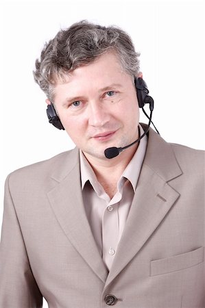 simsearch:400-03933798,k - Handsome man with headset. Customer service. Call center operator.  Hotline operator with headset.  Helpdesk or support operator. Stock Photo - Budget Royalty-Free & Subscription, Code: 400-04586674
