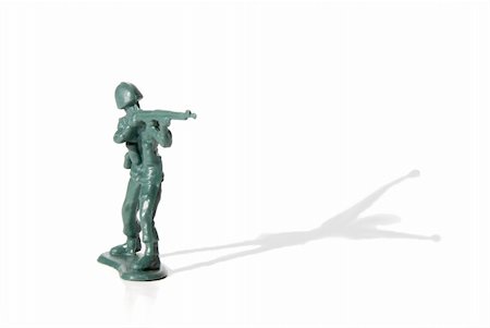 simsearch:400-04072400,k - A toy soldier in battle with his shadow surrendering. Stock Photo - Budget Royalty-Free & Subscription, Code: 400-04588080