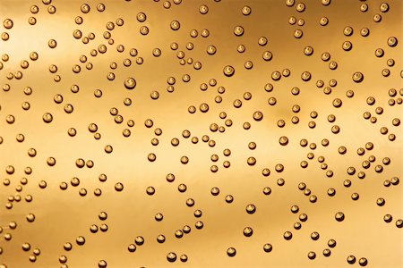 simsearch:622-07519538,k - Bubbles in liquid, golden background Stock Photo - Budget Royalty-Free & Subscription, Code: 400-04588760