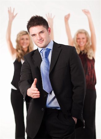 simsearch:400-04790442,k - Attractive businessman with thumb up and his successful team in the background Stock Photo - Budget Royalty-Free & Subscription, Code: 400-04589971