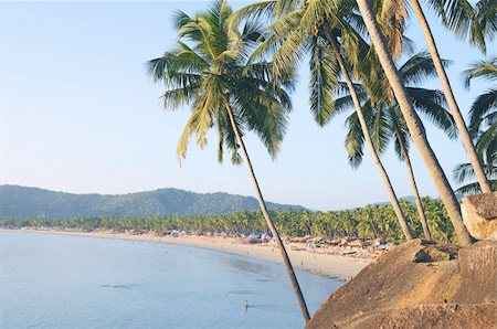 simsearch:400-04062726,k - Palm trees with beautiful seascape on background with mountains, bay, sand beach and shacks. Foto de stock - Super Valor sin royalties y Suscripción, Código: 400-04580794