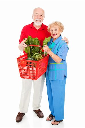 Beautiful senior couple food shopping for healthy organic produce.  Full body isolated on white. Stock Photo - Budget Royalty-Free & Subscription, Code: 400-04582468