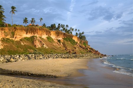 Cliffs on the beach near the ocean over blue sky Photographie de stock - Aubaine LD & Abonnement, Code: 400-04583622