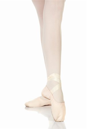 simsearch:400-04119672,k - Young caucasian ballerina girl on white background and reflective white floor showing various ballet steps and positions. Pointe. Not Isolated. Stock Photo - Budget Royalty-Free & Subscription, Code: 400-04595096