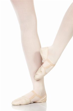 simsearch:400-04119672,k - Young caucasian ballerina girl on white background and reflective white floor showing various ballet steps and positions. Petit retire. Not Isolated. Stock Photo - Budget Royalty-Free & Subscription, Code: 400-04595102