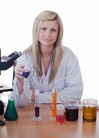 simsearch:400-04881572,k - Young attractive blonde doctor conducting an experiment looking at the camera Stock Photo - Budget Royalty-Free & Subscription, Code: 400-04590646