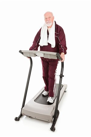 serious 60  exercise - Senior man on treadmill is serious about fitness.  Isolated on white. Stock Photo - Budget Royalty-Free & Subscription, Code: 400-04591498