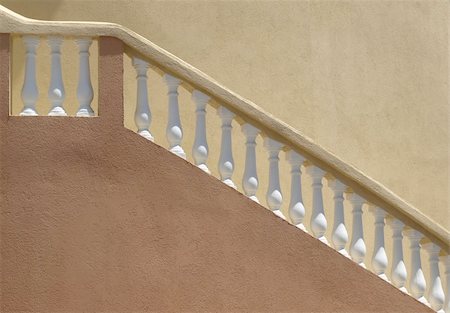 Warm colors on a stucco building with white balustrade staircase railing Stock Photo - Budget Royalty-Free & Subscription, Code: 400-04592579