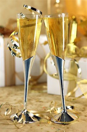 simsearch:400-07166551,k - Golden Champagne Celebration With Bubbly and Gifts Stock Photo - Budget Royalty-Free & Subscription, Code: 400-04593308