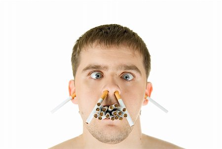 young man with many cigarettes in his mouth Stock Photo - Budget Royalty-Free & Subscription, Code: 400-04605915