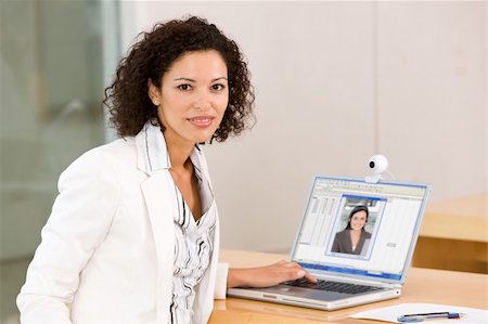 Attractive business woman working on laptop Stock Photo - Budget Royalty-Free & Subscription, Code: 400-04606202