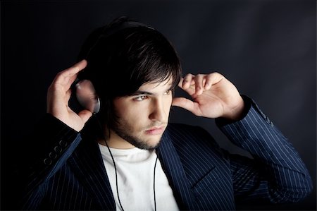 simsearch:400-04300097,k - Young Man listening to music with headphones Stock Photo - Budget Royalty-Free & Subscription, Code: 400-04606322