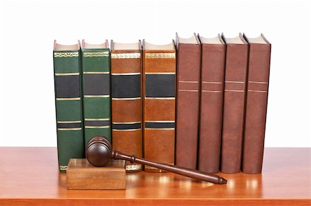 simsearch:700-00028739,k - Wooden gavel from the court and old law books reflected on white background. Shallow depth of file Stock Photo - Budget Royalty-Free & Subscription, Code: 400-04606584