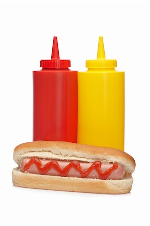 simsearch:400-04587885,k - A hot dog with ketchup and mustard bottles isolated on white background Stock Photo - Budget Royalty-Free & Subscription, Code: 400-04607058