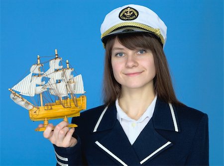 peaked cap - Portrait of the woman in a sea cap with the ship in hand Stock Photo - Budget Royalty-Free & Subscription, Code: 400-04601669