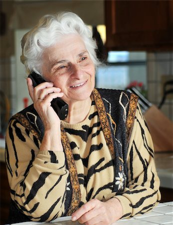 phone one person adult smile elderly - Portrait of a senior woman talking on the phone Stock Photo - Budget Royalty-Free & Subscription, Code: 400-04602461