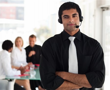 simsearch:400-03933798,k - Young Businessman on a headset Stock Photo - Budget Royalty-Free & Subscription, Code: 400-04602786