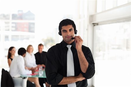simsearch:400-03933798,k - Young Businessman on a headset Stock Photo - Budget Royalty-Free & Subscription, Code: 400-04602787