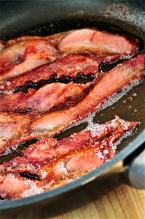 simsearch:400-04885499,k - Bacon strips sizzling on a frying pan Stock Photo - Budget Royalty-Free & Subscription, Code: 400-04602924