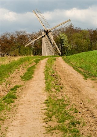 simsearch:400-05319608,k - The old windmill to stand on a green field near wood Stock Photo - Budget Royalty-Free & Subscription, Code: 400-04603030
