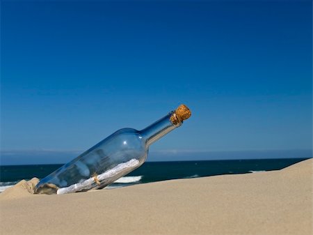 simsearch:700-02080402,k - A bottle with a message inside is buried on the beach. Stock Photo - Budget Royalty-Free & Subscription, Code: 400-04603076