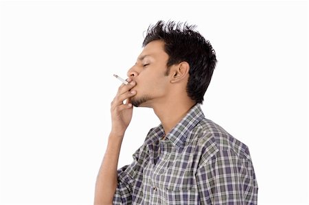 simsearch:400-06761272,k - Close-up of an intensively smoking man with heavy smoke Stock Photo - Budget Royalty-Free & Subscription, Code: 400-04615368