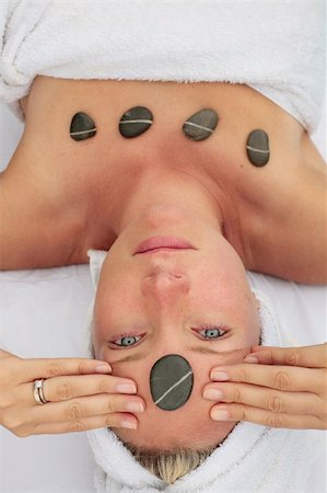 simsearch:400-05318677,k - Woman at a spa with stone on her forehead Stock Photo - Budget Royalty-Free & Subscription, Code: 400-04615586