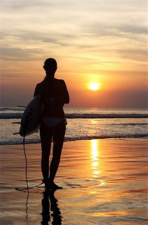 simsearch:400-04127648,k - Surfer with board going into the sea at dawn Photographie de stock - Aubaine LD & Abonnement, Code: 400-04616108