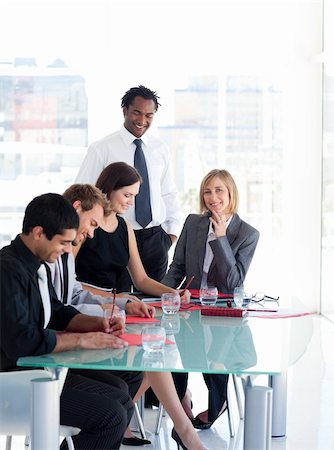 simsearch:400-04113367,k - Multi-ethnic business people working in a meeting Stock Photo - Budget Royalty-Free & Subscription, Code: 400-04616477