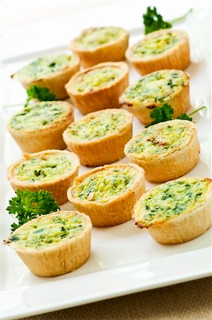 flaky - Plate of many mini bite size quiche appetizers Stock Photo - Budget Royalty-Free & Subscription, Code: 400-04617424