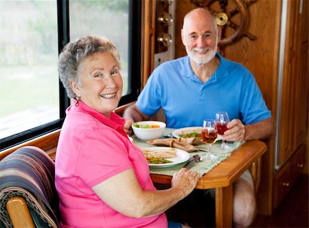 simsearch:400-04208630,k - Senior couple enjoys a healthy lunch in the kitchen of their motor home. Focus on the wife. Stock Photo - Budget Royalty-Free & Subscription, Code: 400-04618008