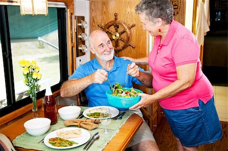 simsearch:400-04208630,k - Senior couple enjoying a healthy meal in their luxury motor home. Stock Photo - Budget Royalty-Free & Subscription, Code: 400-04618014