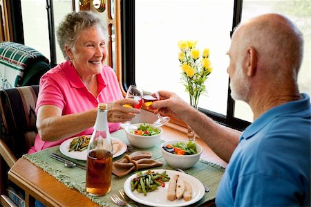 simsearch:400-04208630,k - Senior couple enjoying a romantic dinner in their motor home. Stock Photo - Budget Royalty-Free & Subscription, Code: 400-04618012