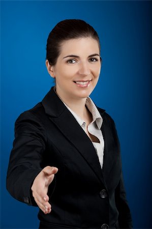 simsearch:400-04351235,k - Beautiful and young businesswoman giving a shake hand Stock Photo - Budget Royalty-Free & Subscription, Code: 400-04618796