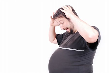 fat man exercising - Pragnant man with big stomach with surprised expression on face Stock Photo - Budget Royalty-Free & Subscription, Code: 400-04619261