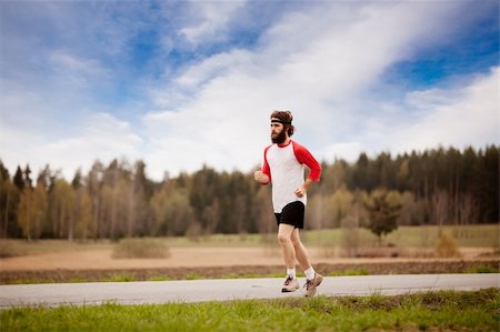 dreadlocks on old people - A runner with long hair and beard jogging in the country Stock Photo - Budget Royalty-Free & Subscription, Code: 400-04610569