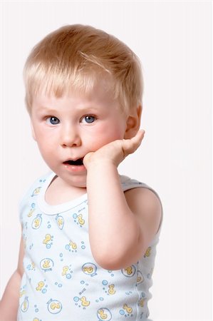 shy baby - Portrait of the blond little boy on a background Stock Photo - Budget Royalty-Free & Subscription, Code: 400-04612047