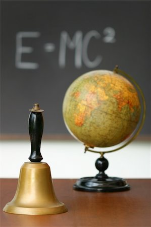 Old school bell on desk in front of chalkboard Stock Photo - Budget Royalty-Free & Subscription, Code: 400-04612525