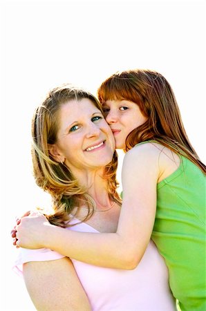 Portrait of happy child hugging and kissing her mother Stock Photo - Budget Royalty-Free & Subscription, Code: 400-04612785