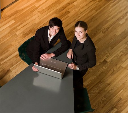 Two women from above with a computer Stock Photo - Budget Royalty-Free & Subscription, Code: 400-04612822