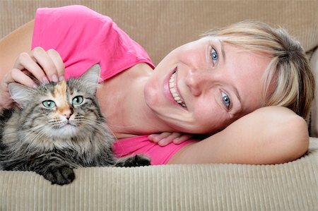 spanishalex (artist) - Pretty girl and cute cat on the sofa Stock Photo - Budget Royalty-Free & Subscription, Code: 400-04624423