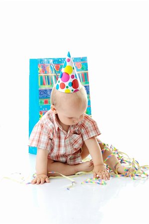 simsearch:400-07748141,k - Child boy in birthday hat over white Foto de stock - Super Valor sin royalties y Suscripción, Código: 400-04624901