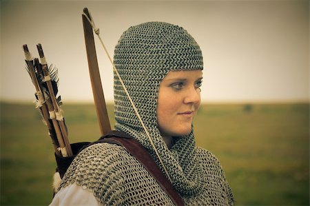 female vintage helmet - bows woman / medieval armor / historical story  / retro split toned Stock Photo - Budget Royalty-Free & Subscription, Code: 400-04625754